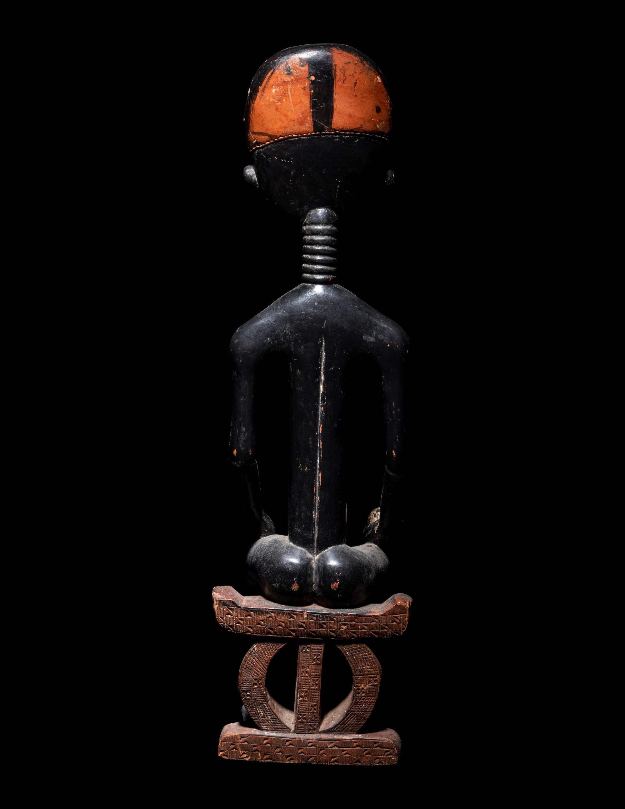 An Akan Wood Figure Seated on a Throne