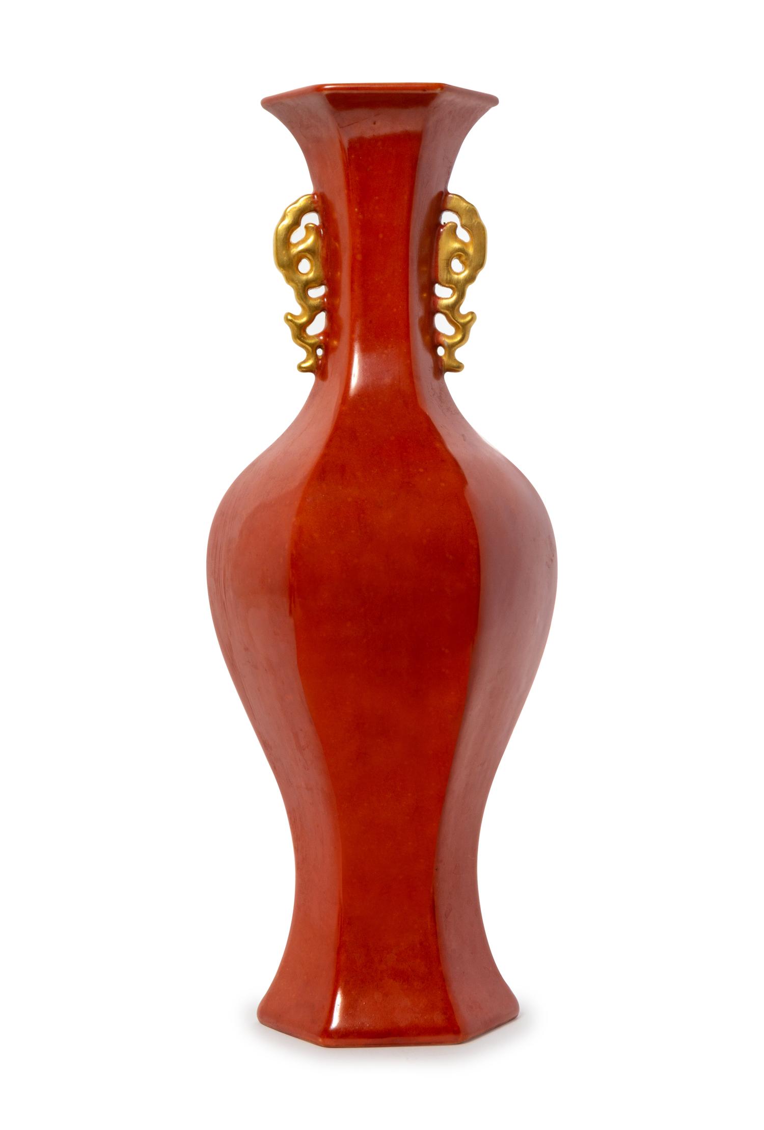 A Red Glazed Porcelain Double Handled Faceted Vase