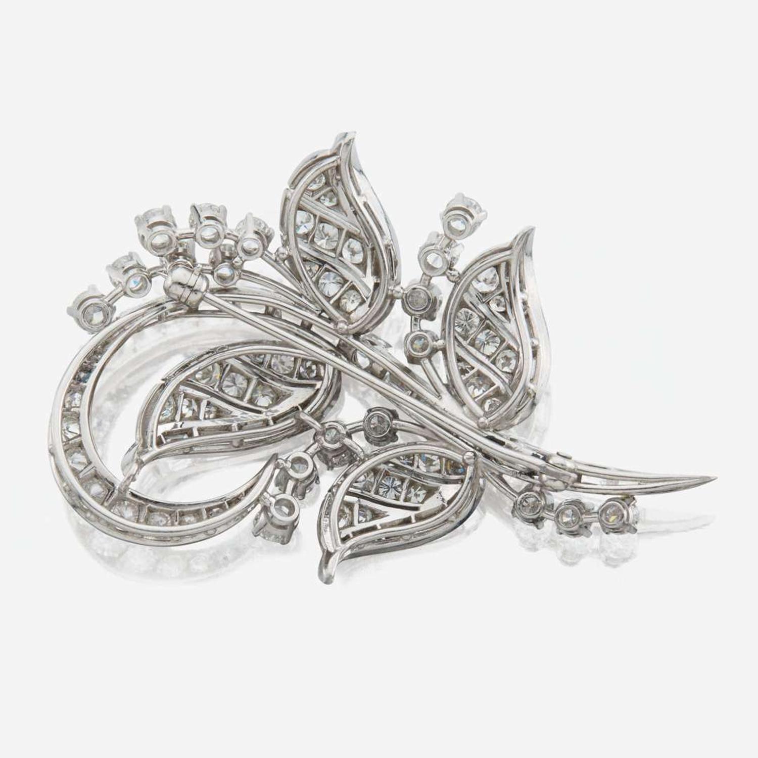 A diamond and platinum brooch