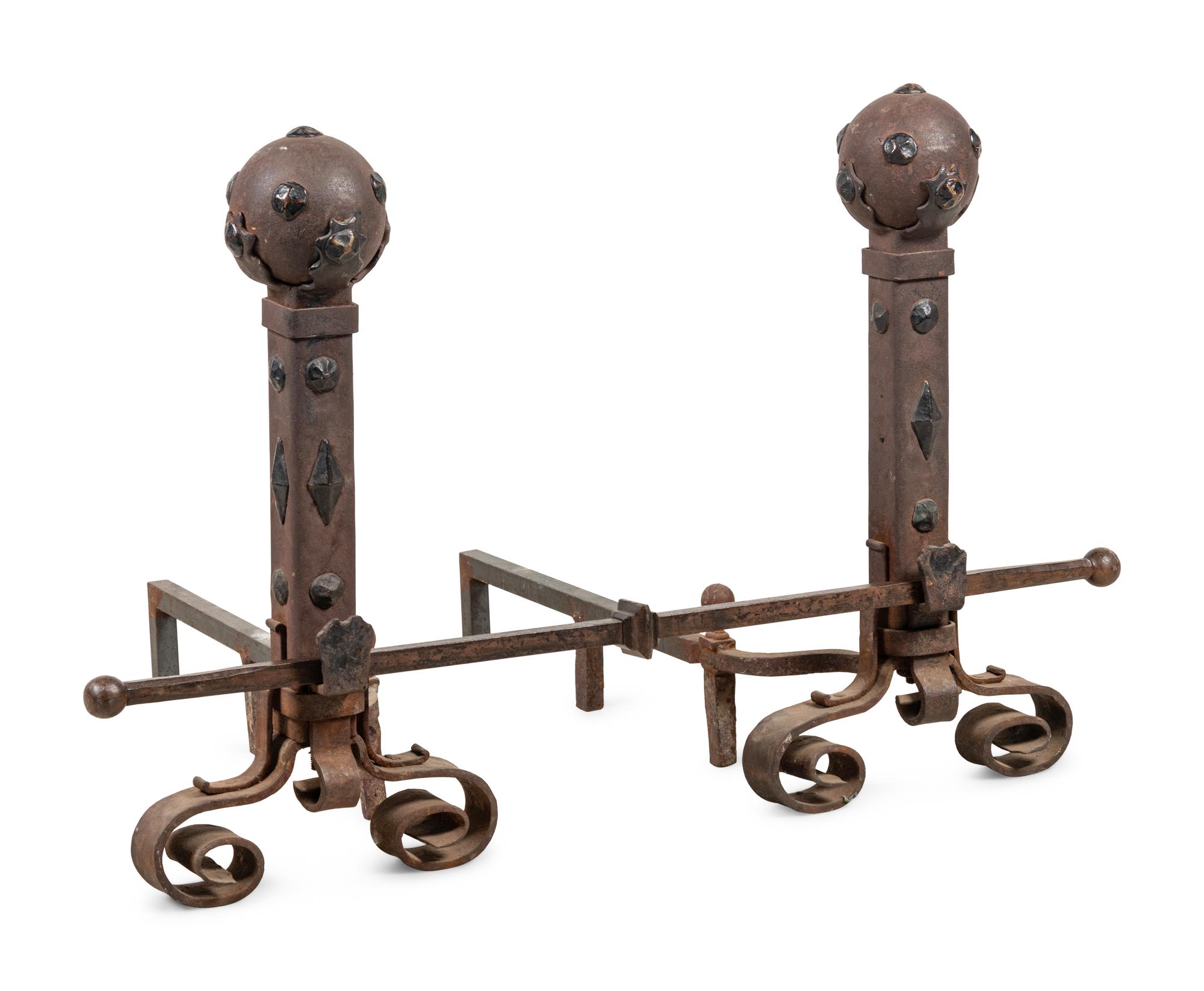 A Pair of Continental Gothic Style Iron Andirons