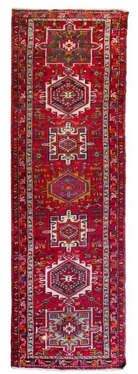 A Heriz Wool Runner 10 feet 8 1/2 inches x 2 feet 10 1/2 inches.