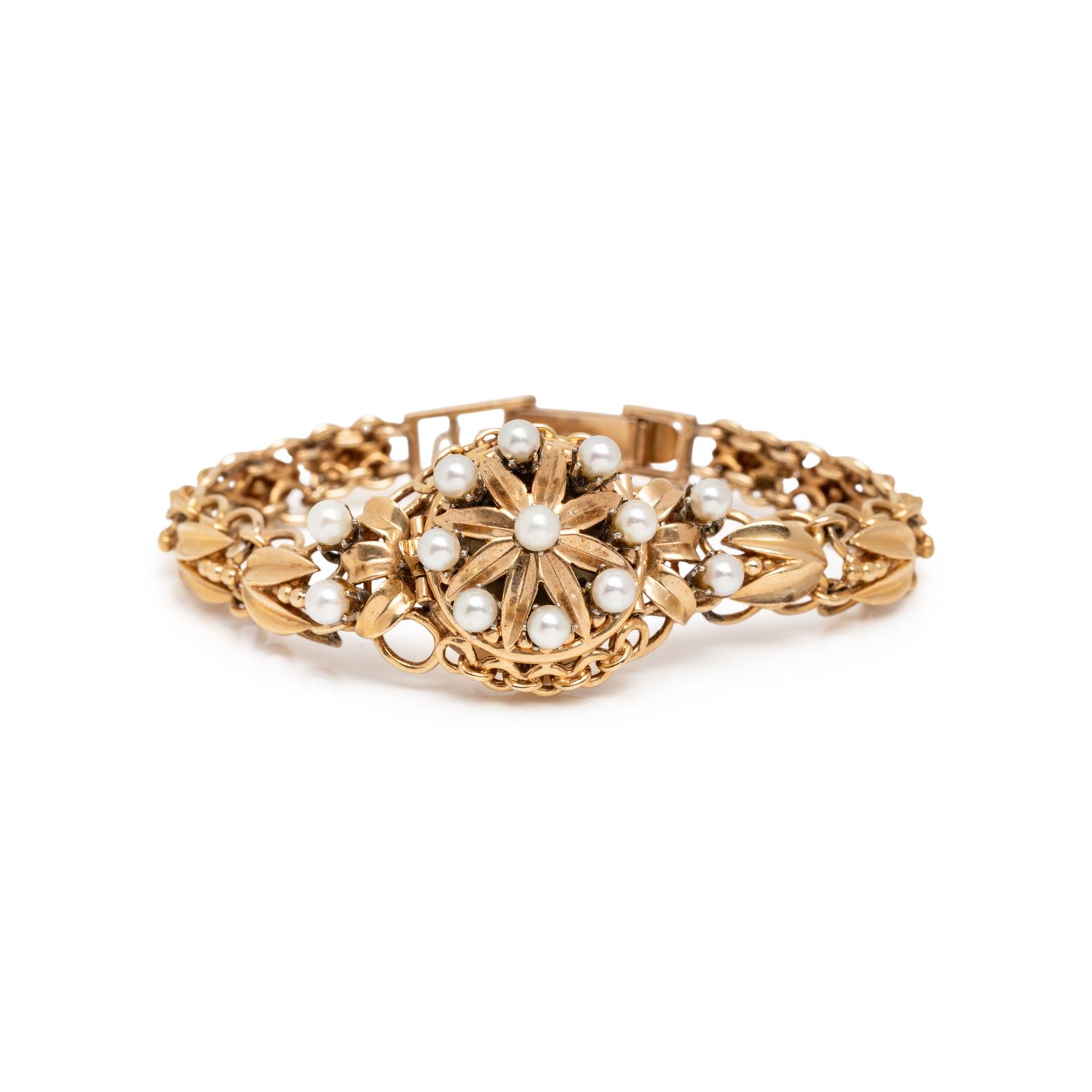 BIRKS, YELLOW GOLD AND CULTURED PEARL SURPRISE WATCH