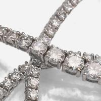 A Diamond and 18K White Gold Rivière Style Necklace
