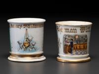 Two Retailer's Porcelain Occupational Shaving Mugs