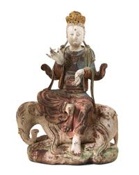 A Southeast Asian Polychromed Carved Wood Figure of Bodhisattva Astride an Elephant Height 32 1/2 inches. — 19TH CENTURY