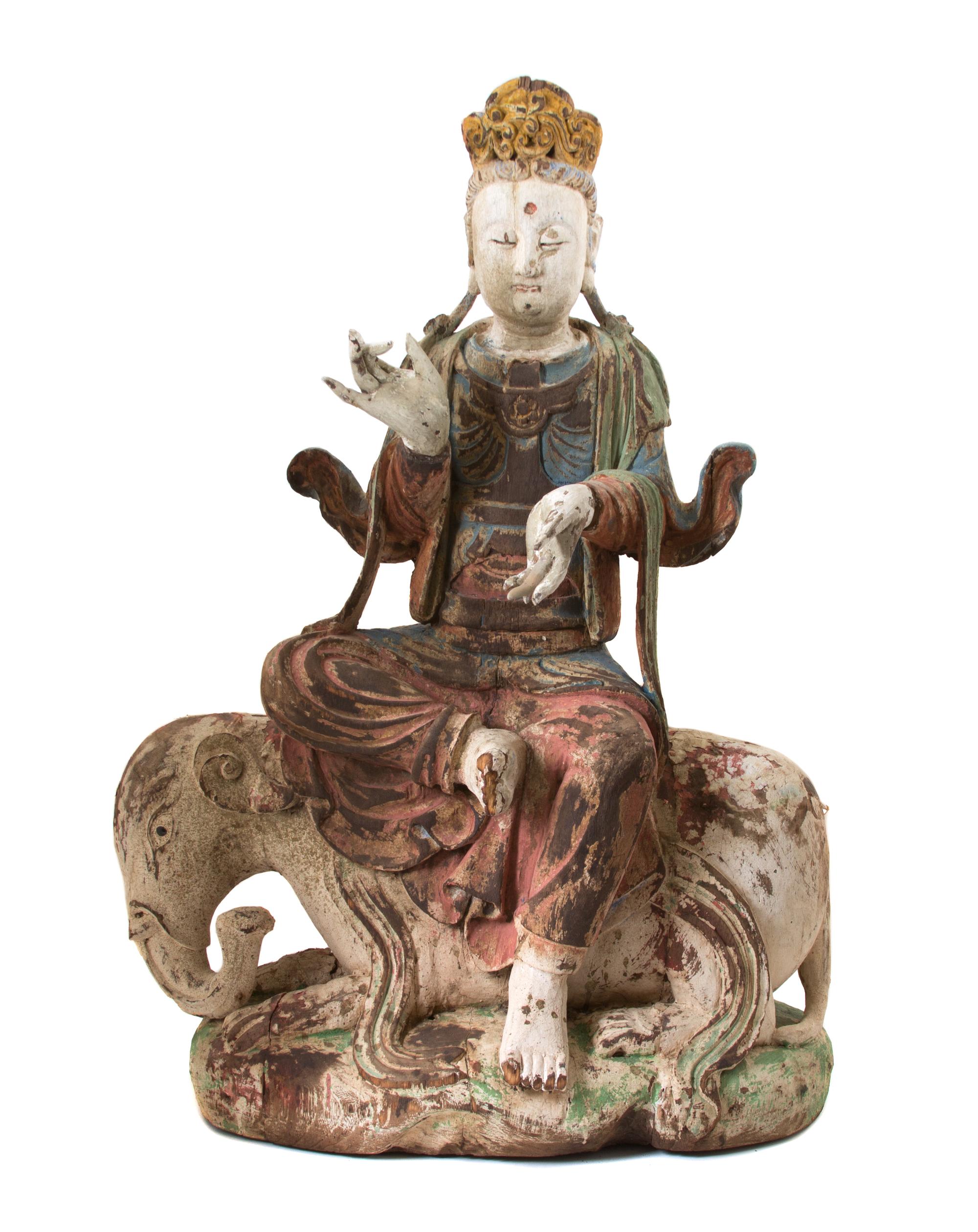 A Southeast Asian Polychromed Carved Wood Figure of Bodhisattva Astride an Elephant Height 32 1/2 inches. — 19TH CENTURY