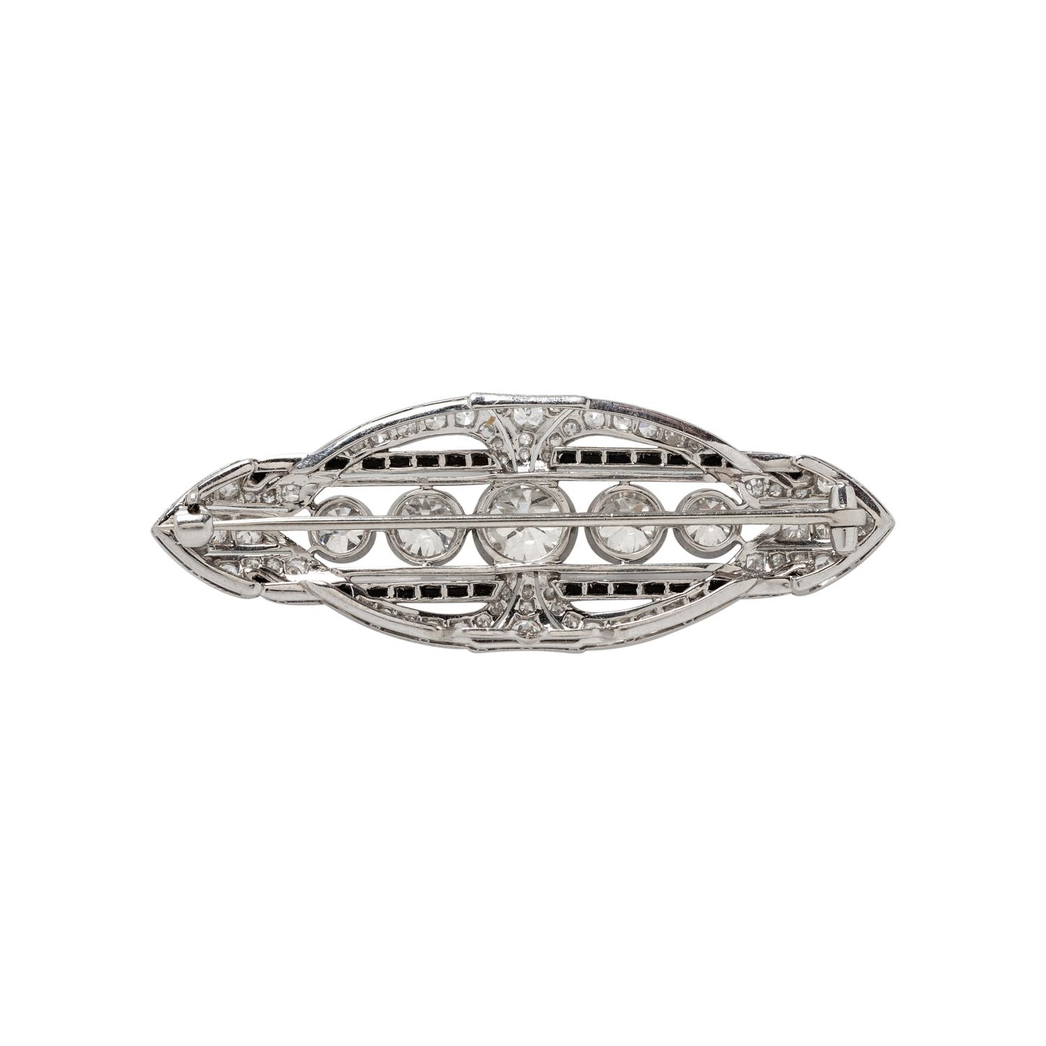 ART DECO, PLATINUM, DIAMOND, AND ONYX BROOCH