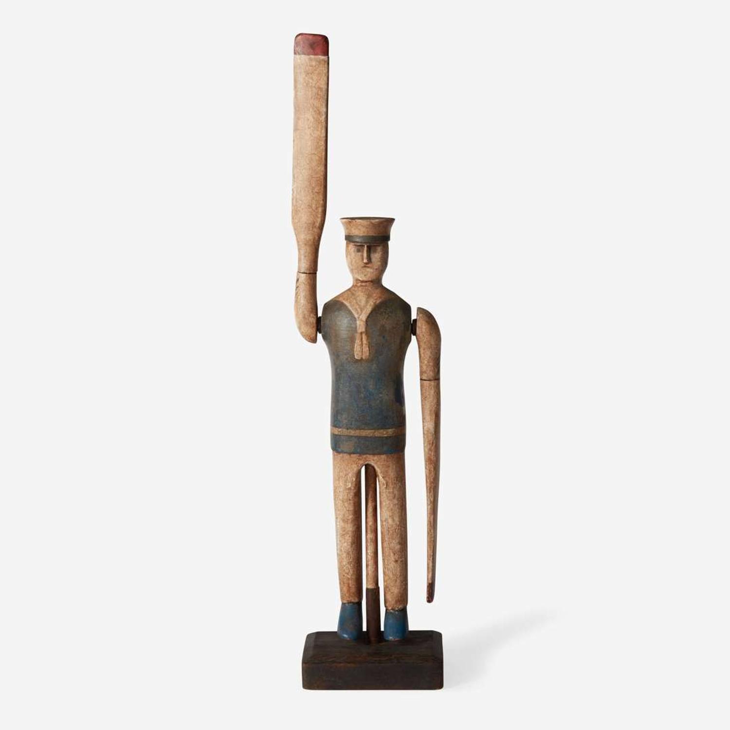 A carved and painted wood sailor whirligig