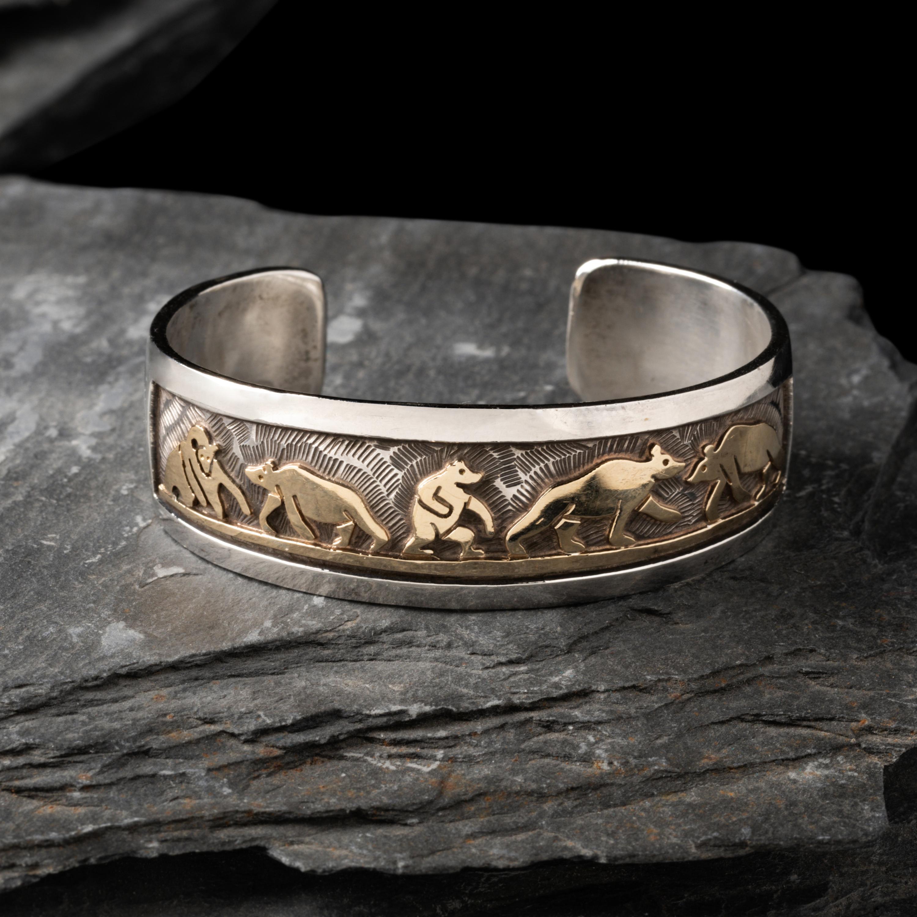 Watson Honanie (Hopi, 1953-2023) — Sterling Silver with 14K Gold Overlay Cuff Bracelet, with Bear Scene