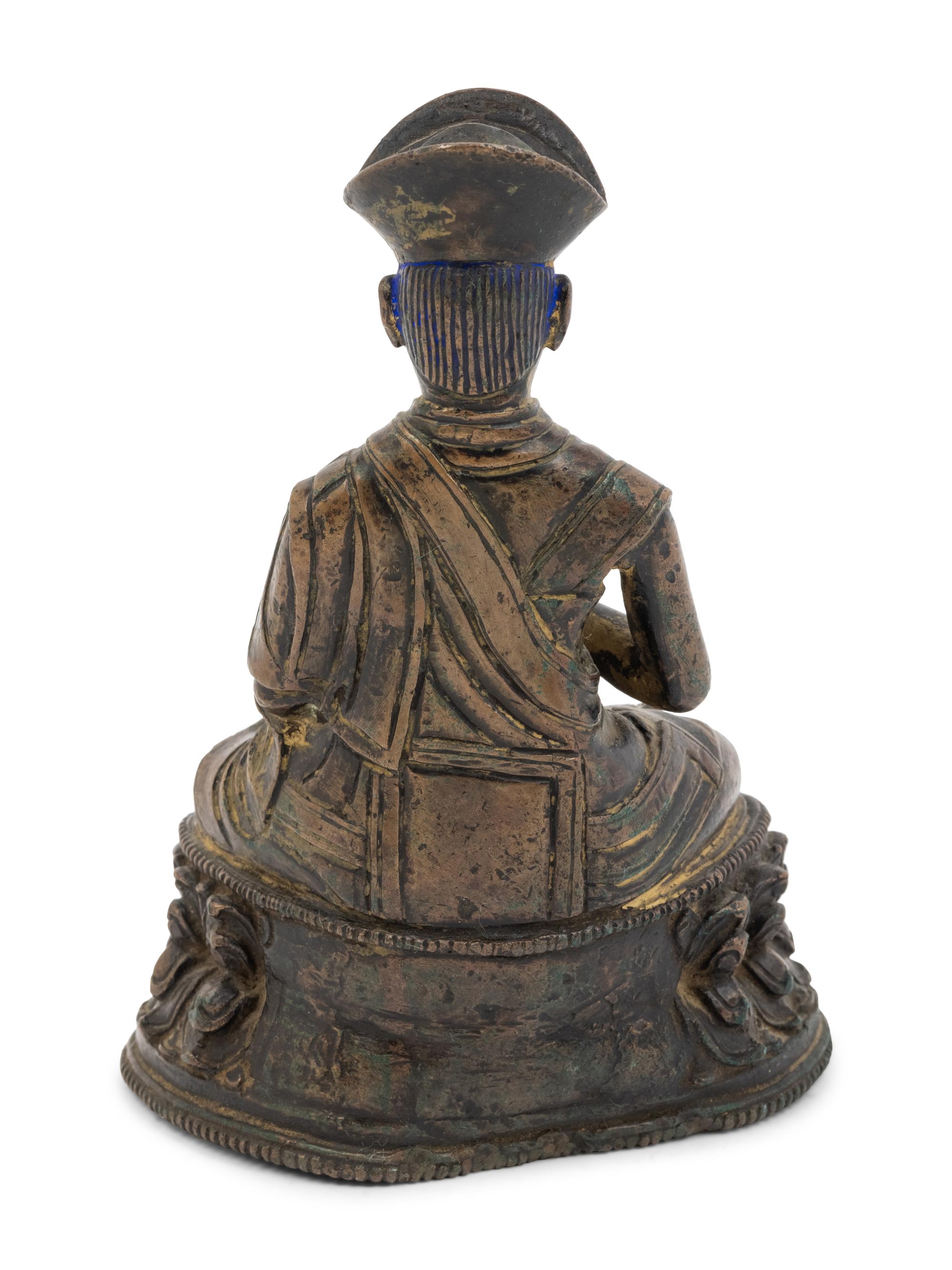 A Tibetan Bronze Figure of a Lama