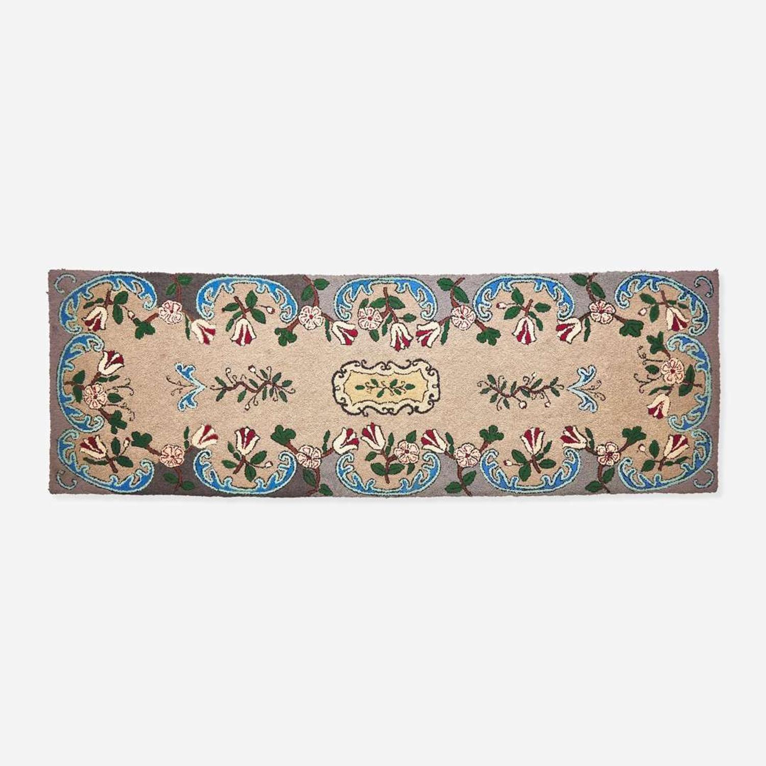 A floral patterned hooked runner 20th century