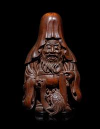 The Nagatani Trademark - A Japanese Carved Hardwood Figure of a Wise Man