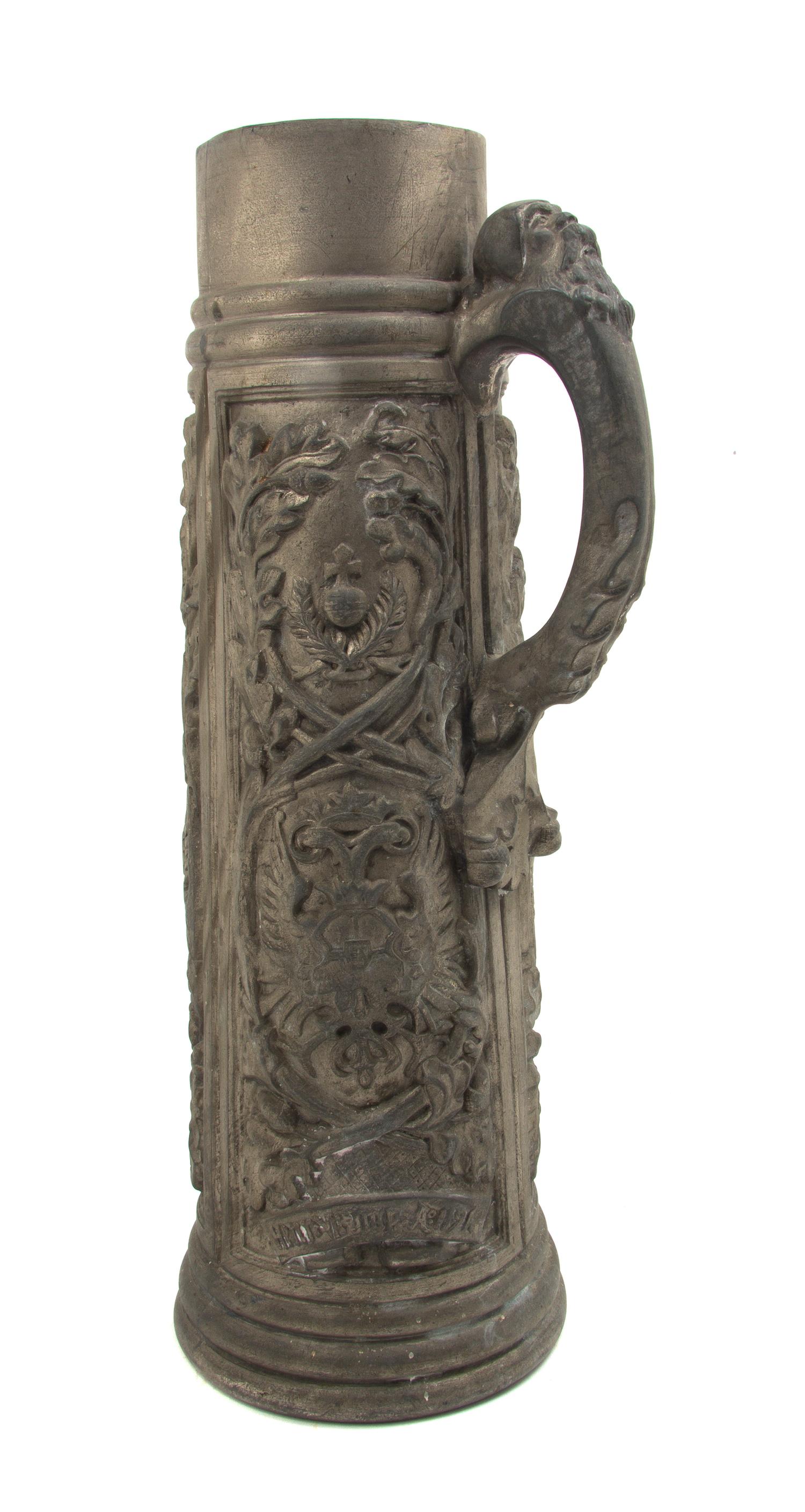 An English Pewter Tankard, Height 17 1/4 inches.