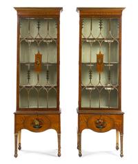 A Pair of Edwardian Painted Satinwood Vitrine Cabinets Height 60 x width 25 x depth 14 inches (excluding base). — CIRCA 1910
