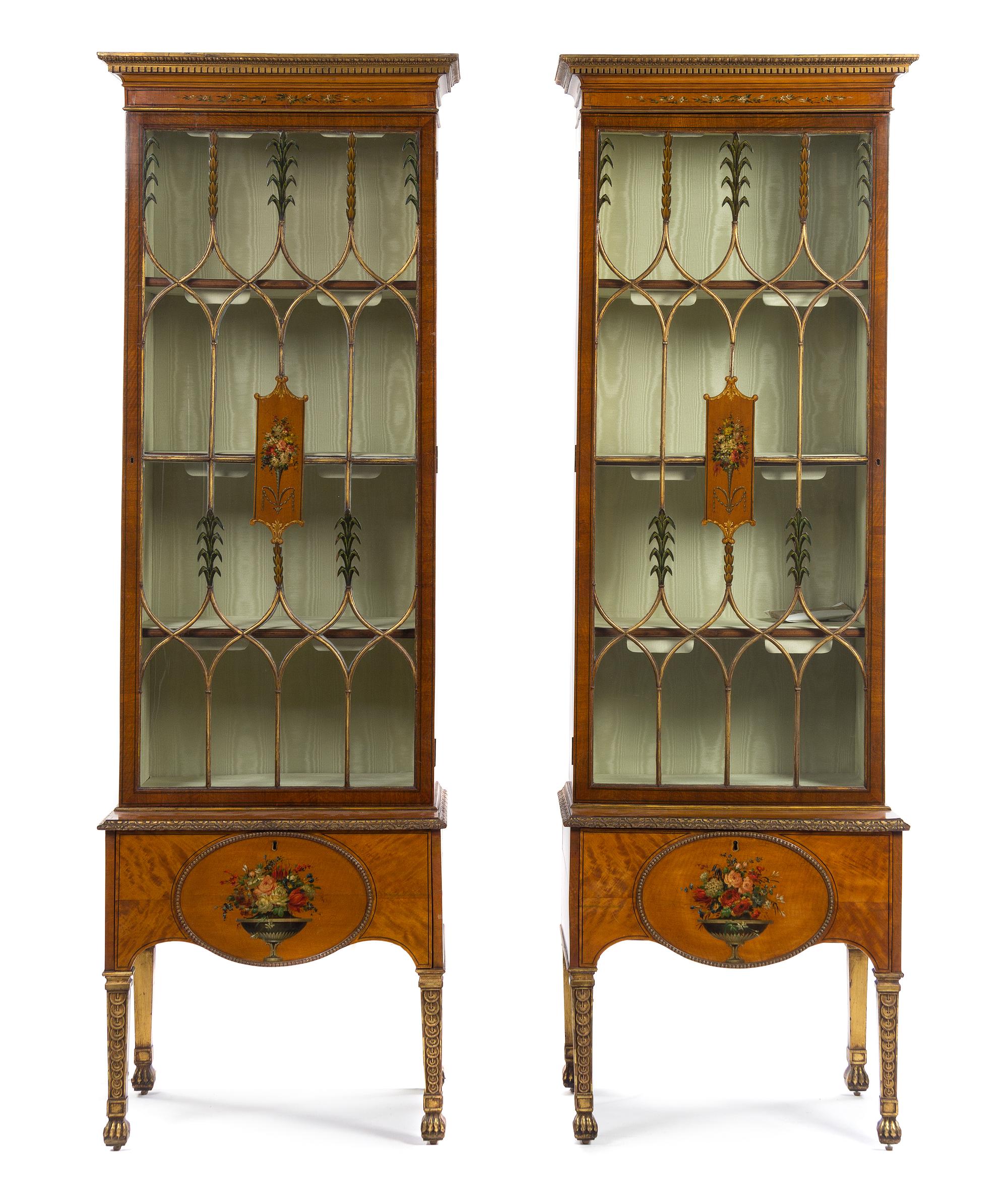 A Pair of Edwardian Painted Satinwood Vitrine Cabinets Height 60 x width 25 x depth 14 inches (excluding base). — CIRCA 1910