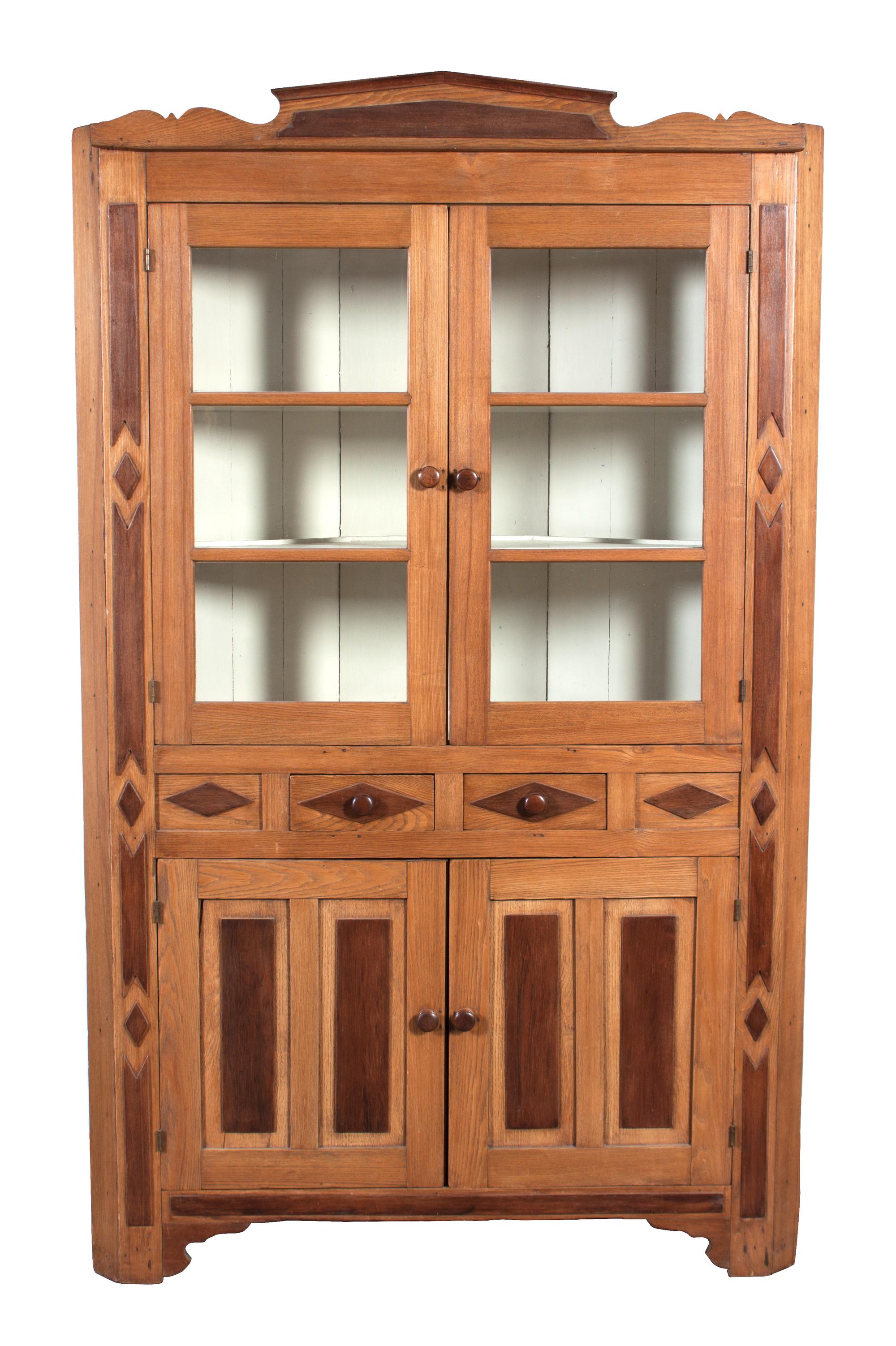 An Inlaid Wood Norwegian Corner Cupboard Height 84 x width 52 x depth 19 inches.