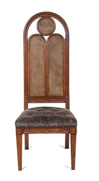 A Gothic Revival Style Carved Oak Chair Height 58 inches. — 20TH CENTURY
