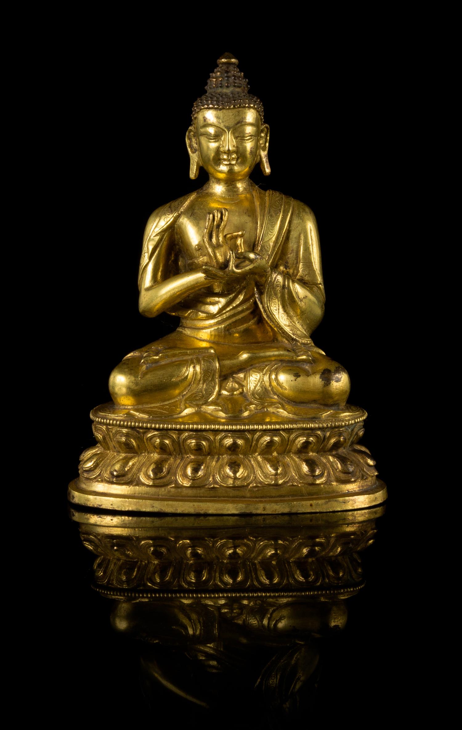 A Gilt Bronze Figure of Buddha Height 6 1/4 inches.