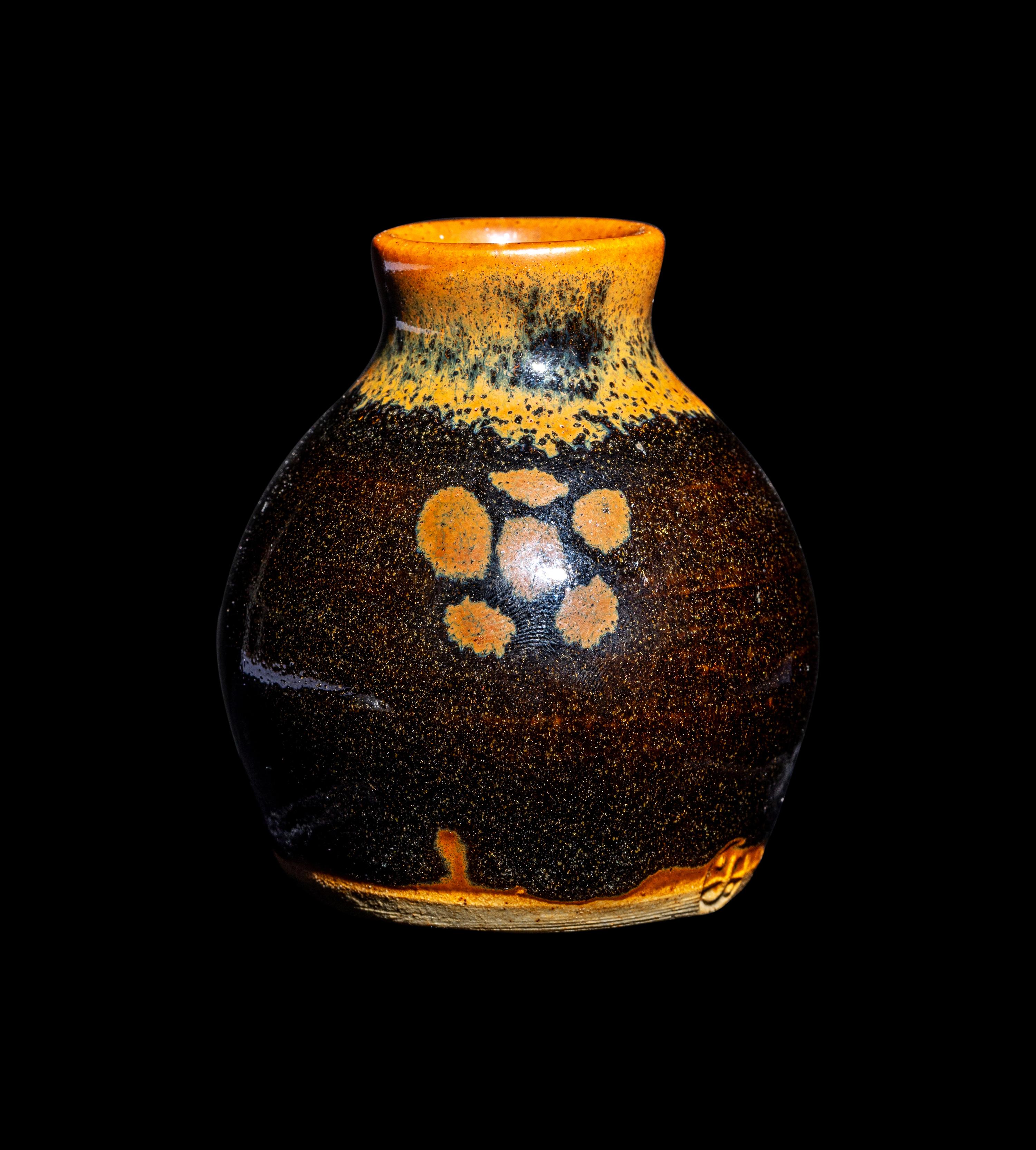 A Small Dark Brown Glazed Stoneware Jar