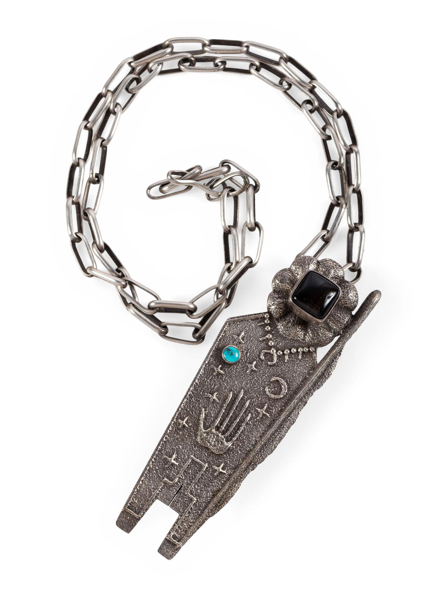 Tufa Cast Silver Figural Pendant, set with Jet and Turquoise