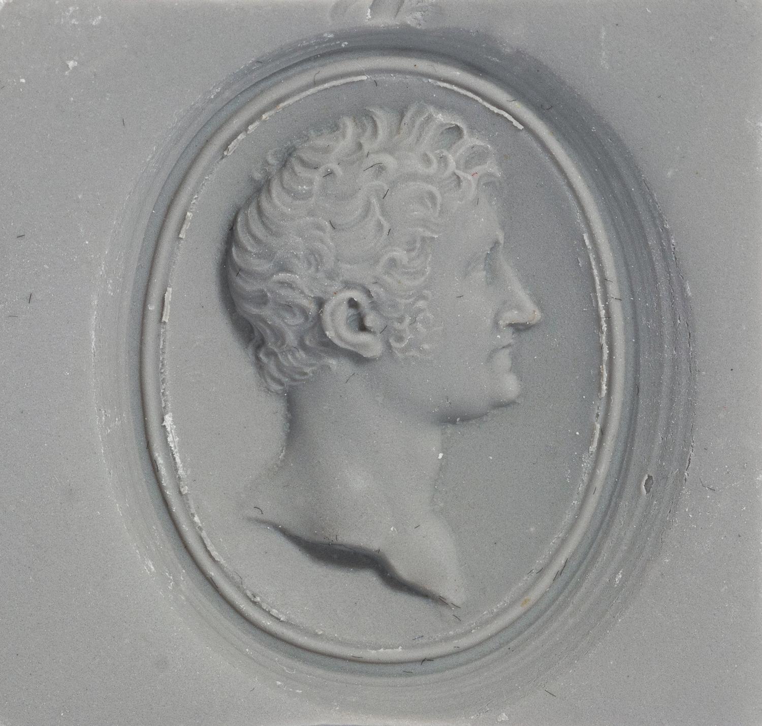 A Victorian Gold and Glass Pendant with a Male Portrait Bust