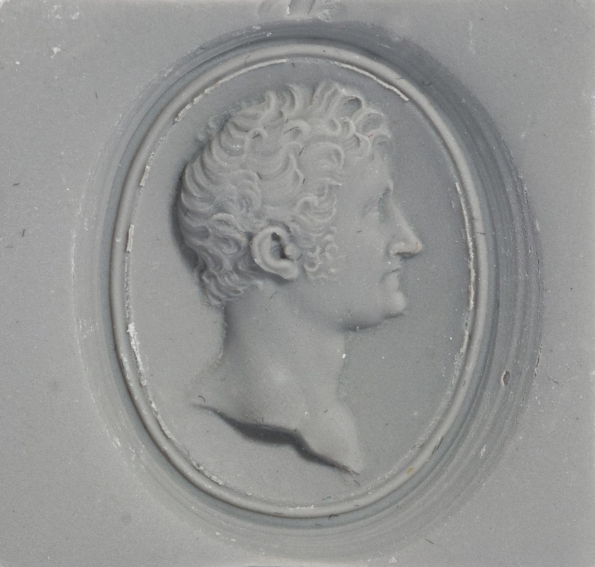 A Victorian Gold and Glass Pendant with a Male Portrait Bust