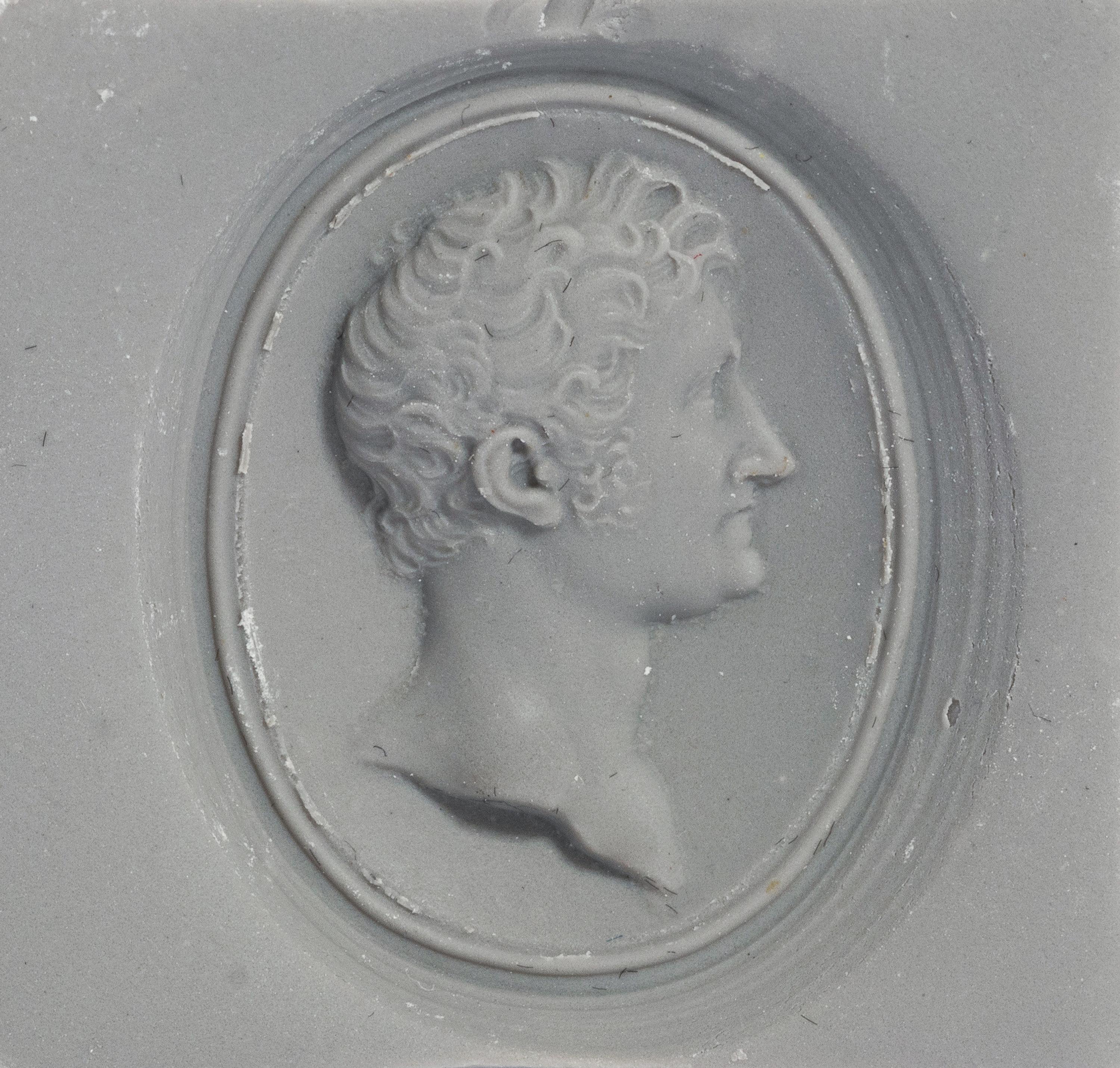 A Victorian Gold and Glass Pendant with a Male Portrait Bust