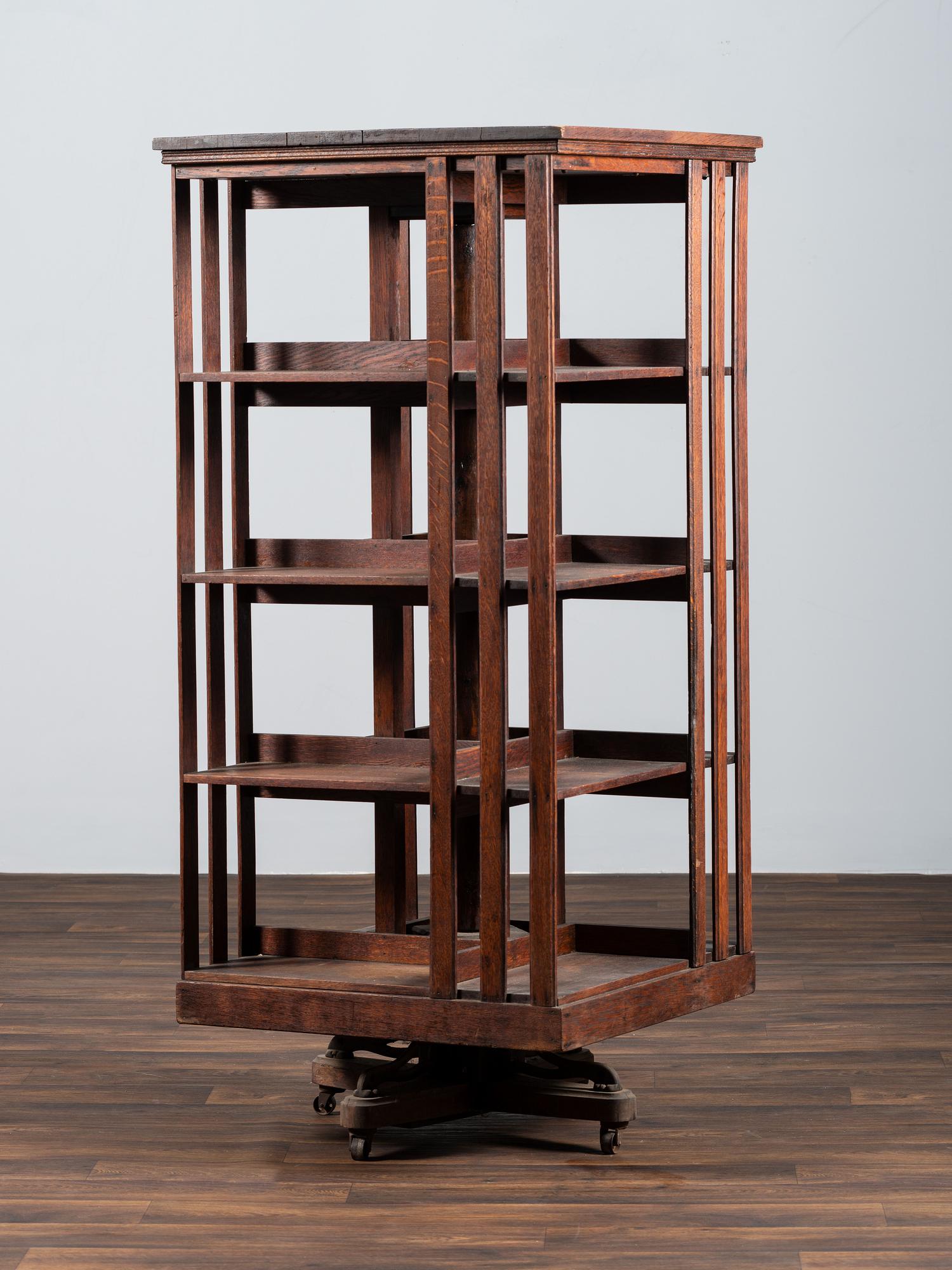 A Country Store Iron-Mounted Oak Rotating Bookshelf