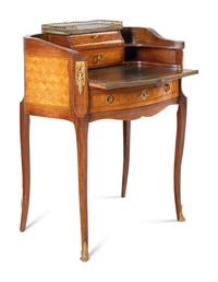 A Louis XV/XVI Transitional Style Gilt Metal Mounted Parquetry Writing Table