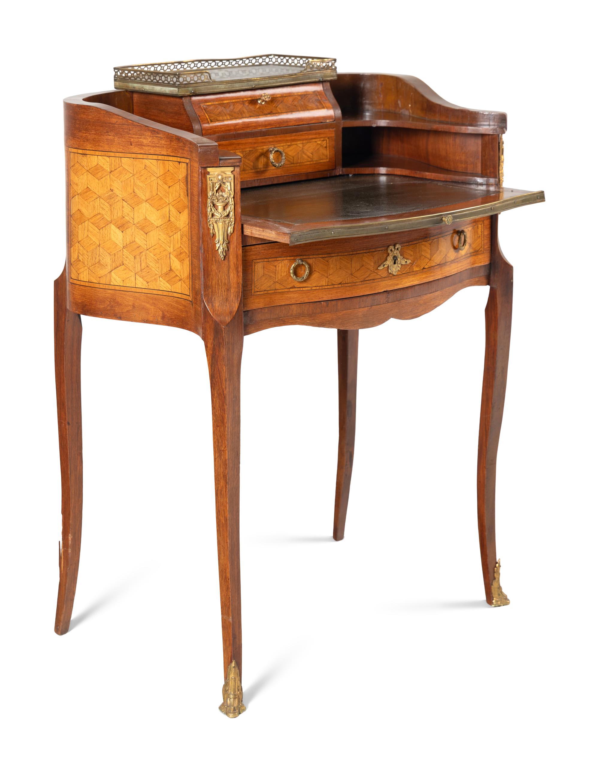 A Louis XV/XVI Transitional Style Gilt Metal Mounted Parquetry Writing Table