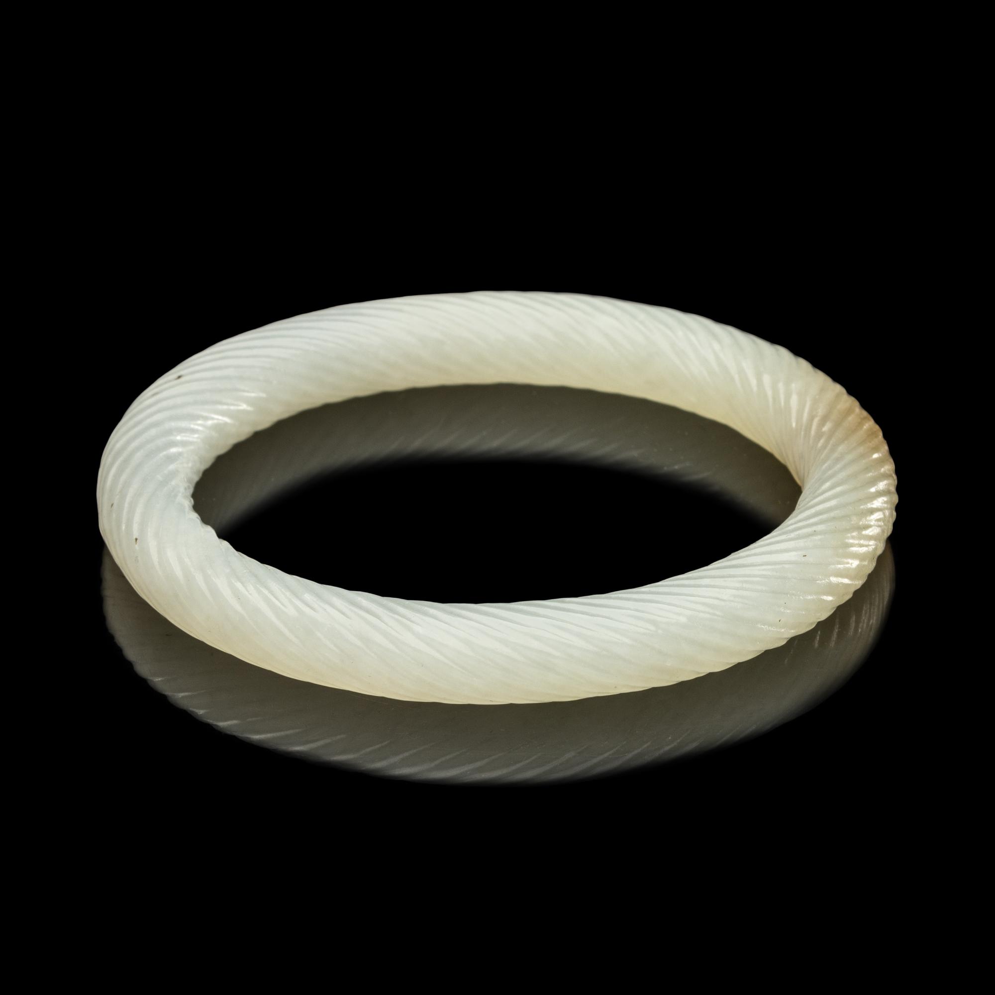 A Chinese Carved Jade Bangle