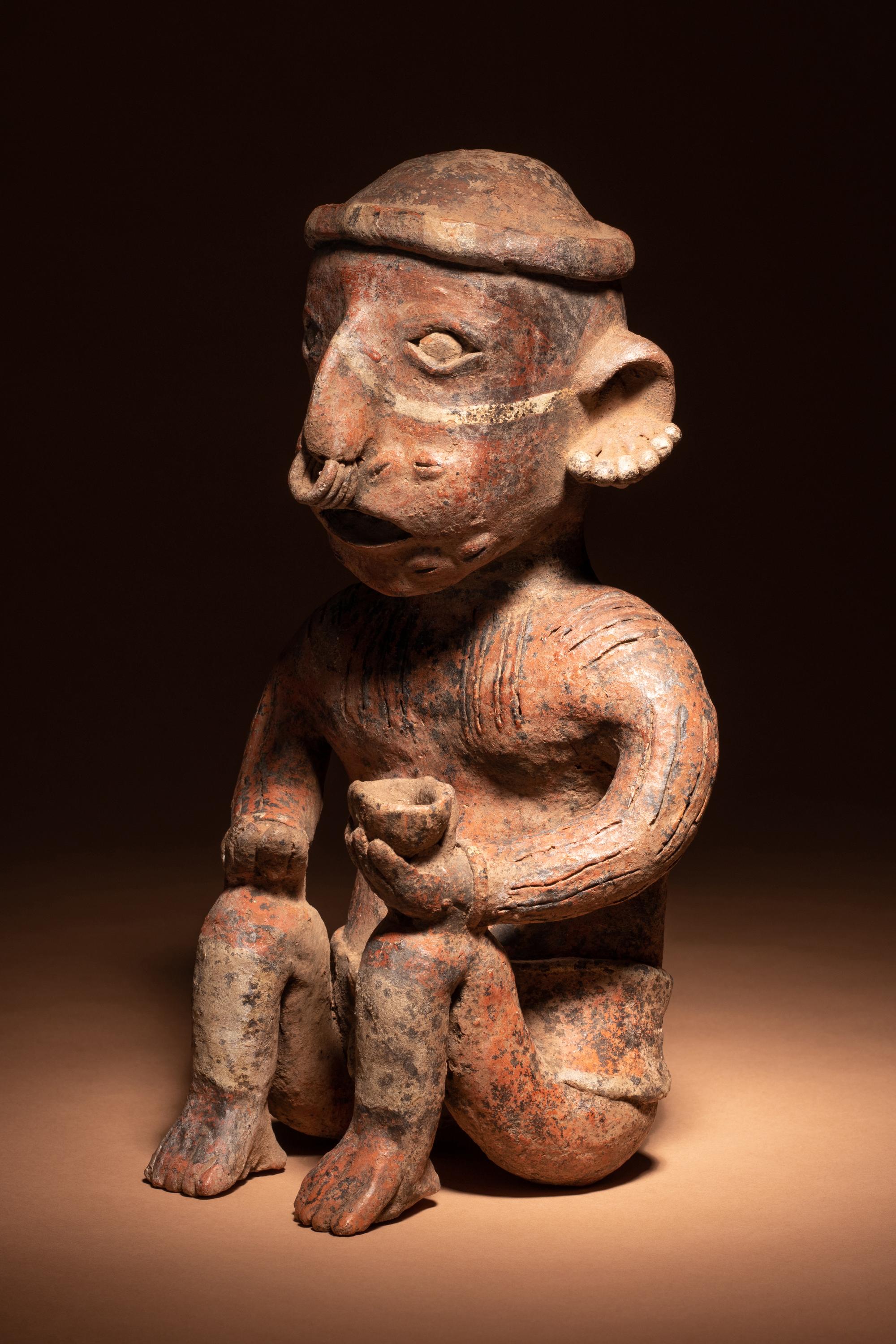 A Nayarit Seated Male Figure