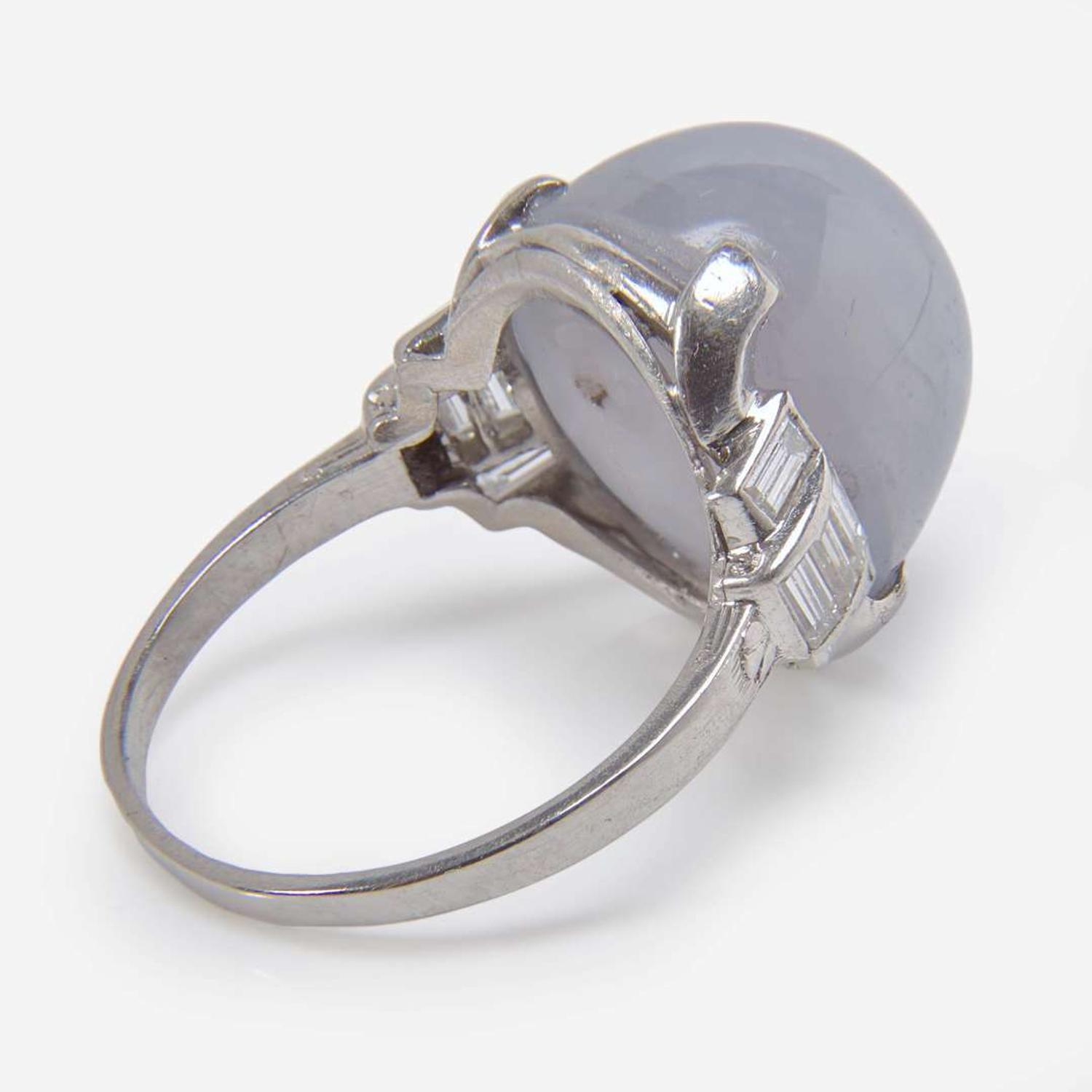 A Platinum, Diamond, and Star Sapphire Ring