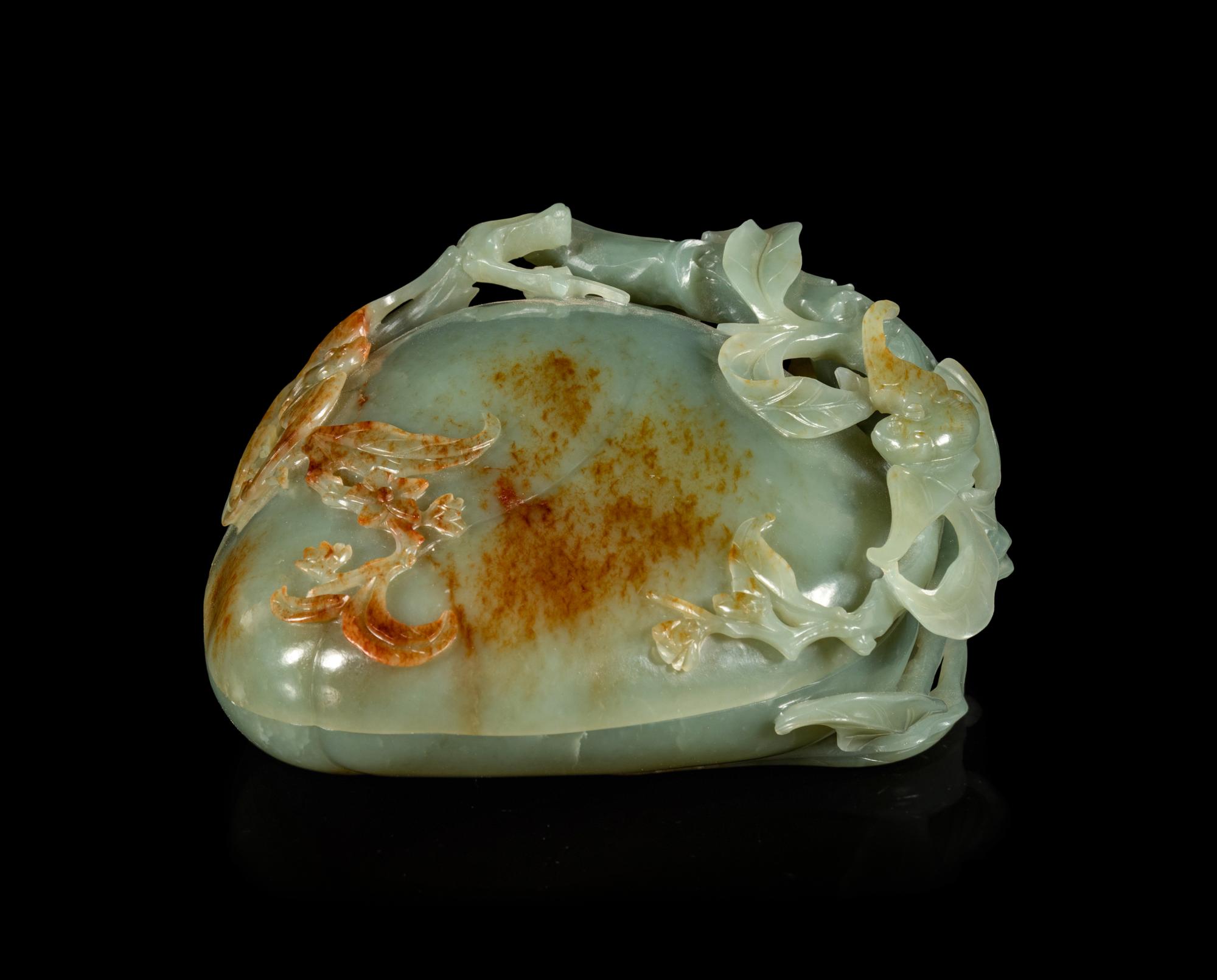 A Russet and Celadon Jade 'Peach and Bat' Covered Box