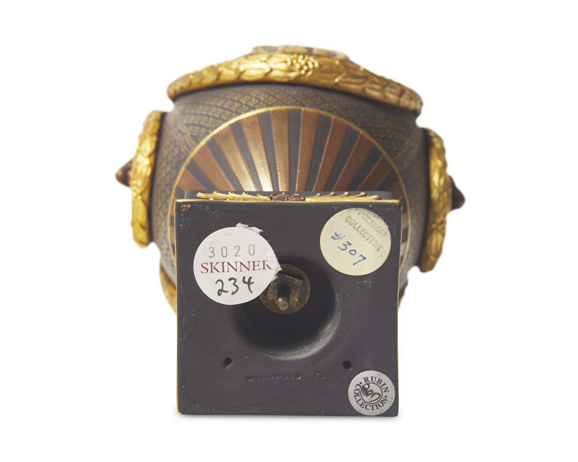 A Wedgwood Brown Glazed and Parcel Gilt Black Basalt Covered Urn