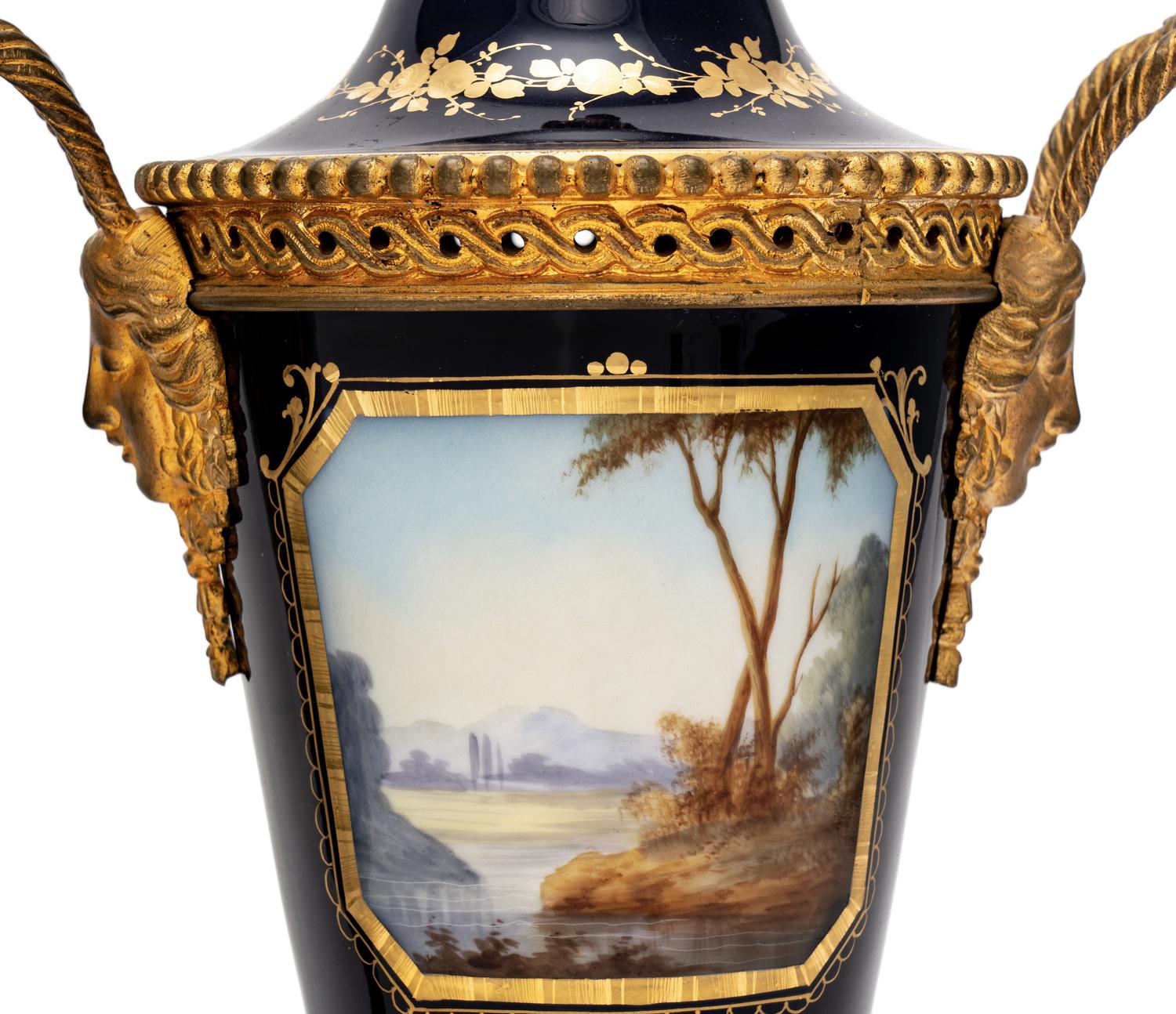 A Pair of Sèvres Style Gilt Bronze-Mounted Porcelain Urns