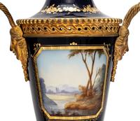 A Pair of Sèvres Style Gilt Bronze-Mounted Porcelain Urns