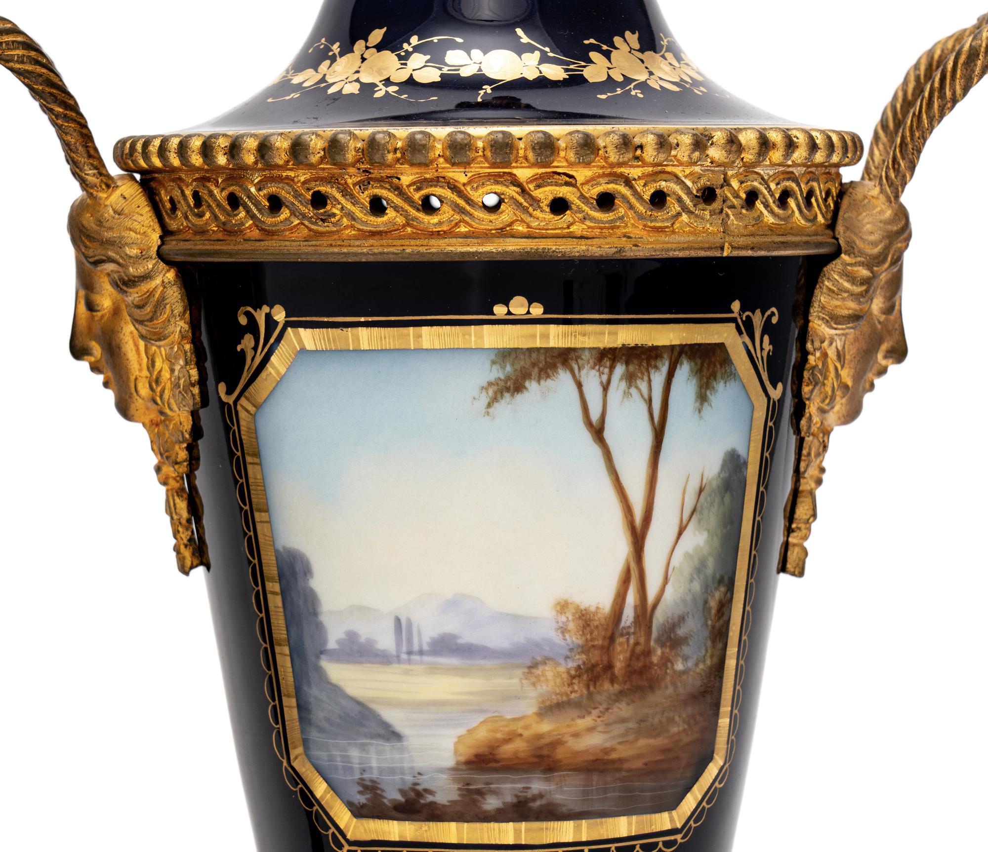 A Pair of Sèvres Style Gilt Bronze-Mounted Porcelain Urns