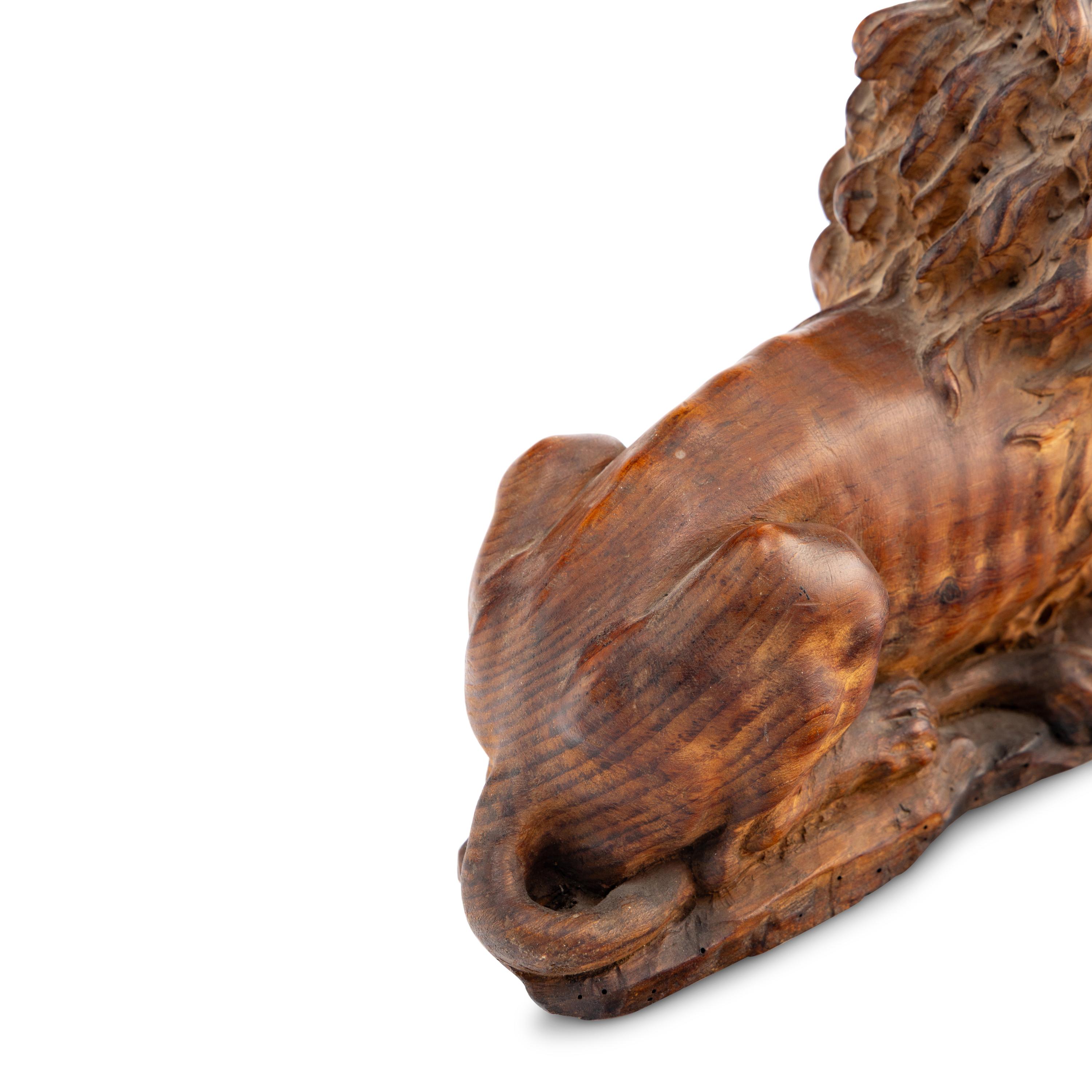 A Carved Oak Model of a Lion