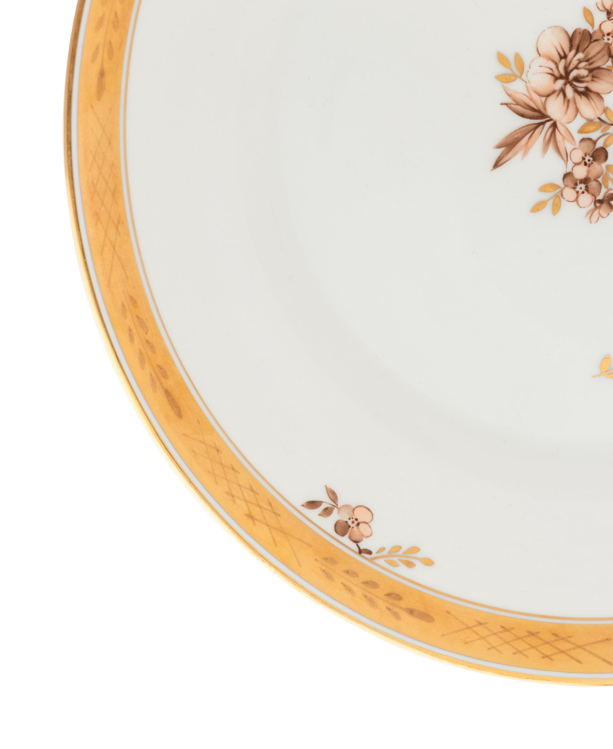 A Royal Copenhagen Golden Basket Porcelain Dinner Service