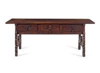 A Continental Carved Walnut Trestle Table