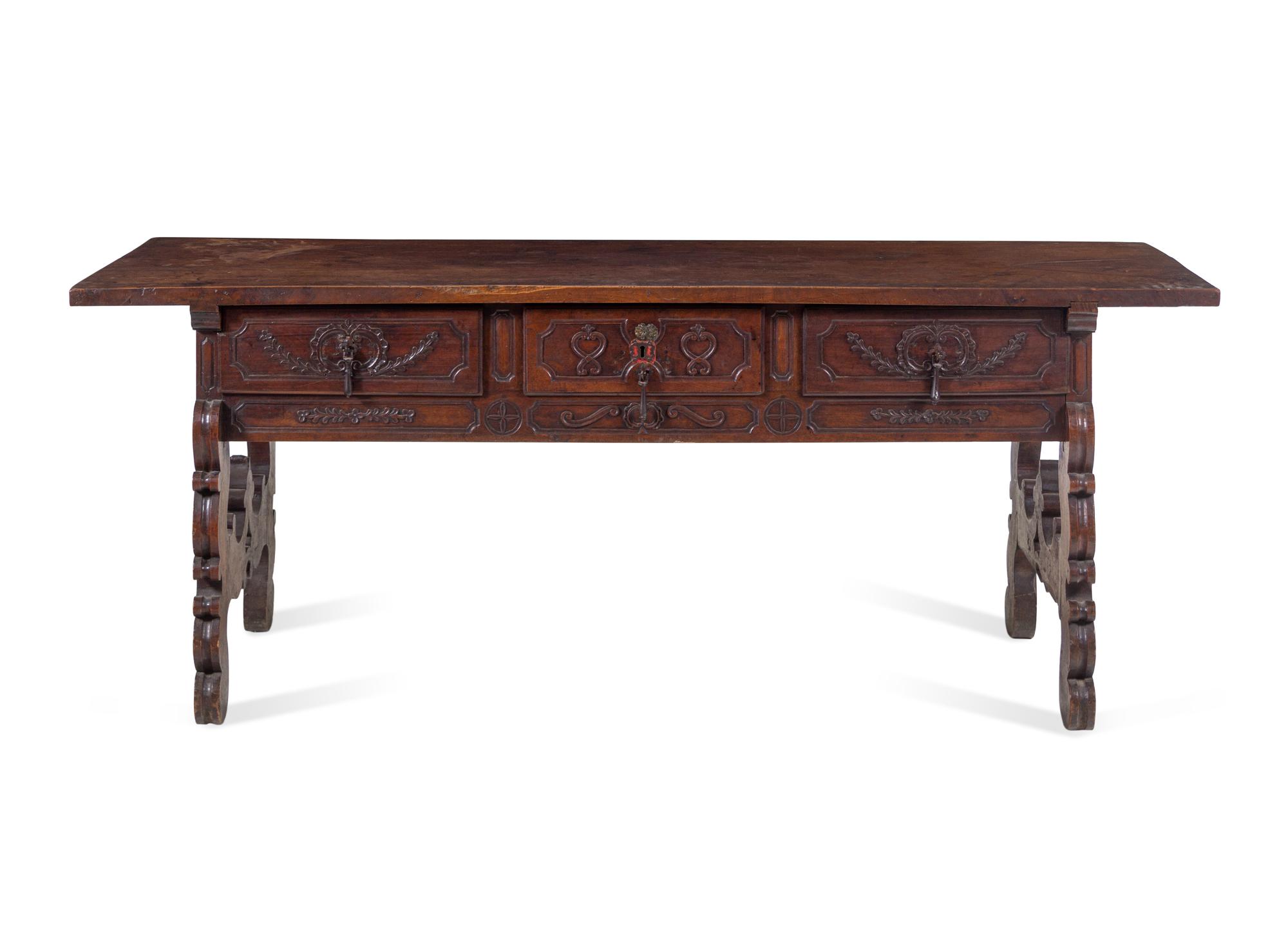 A Continental Carved Walnut Trestle Table