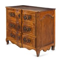 A Louis XV Provincial Walnut Serpentine-Front Commode