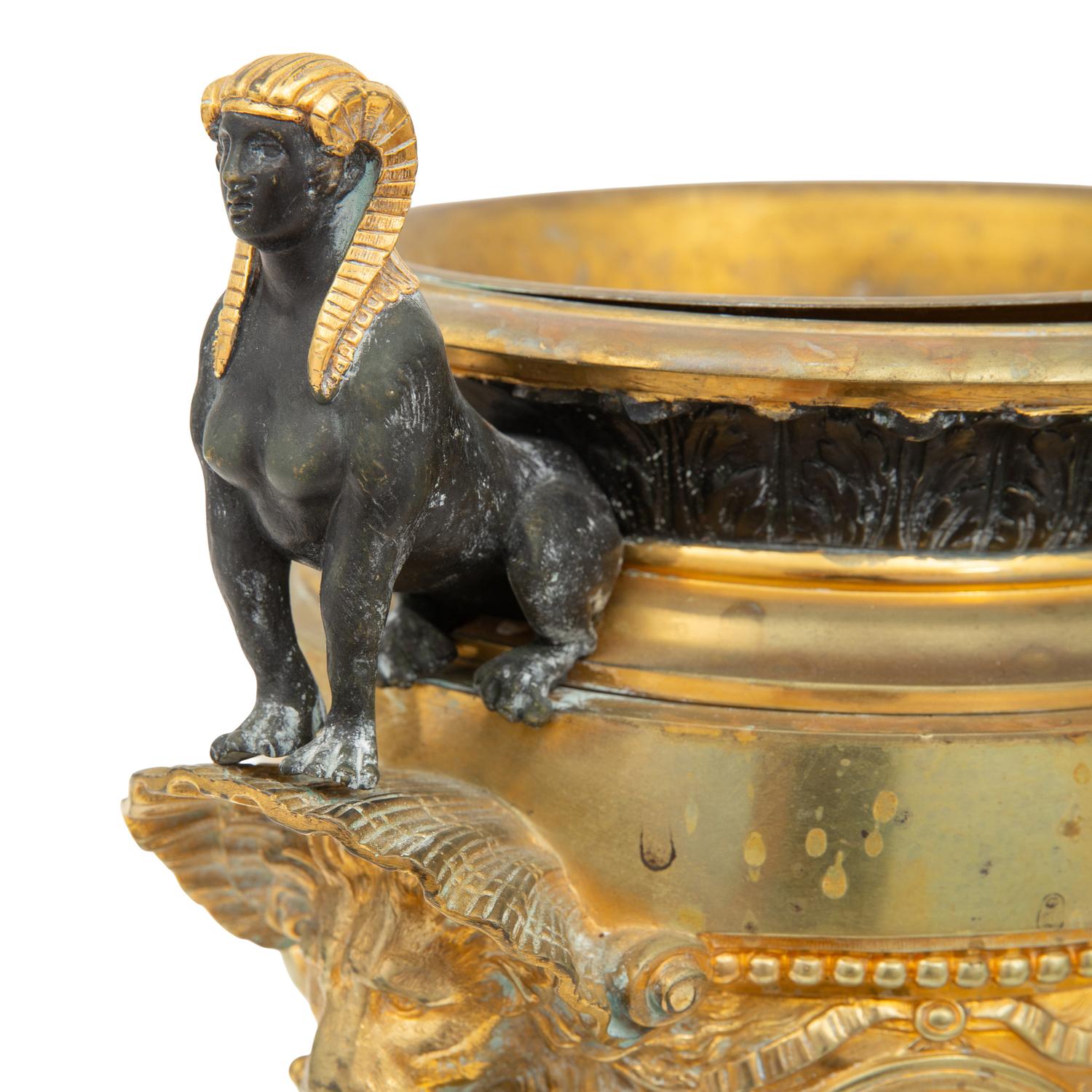 A Pair of French Egyptian Revival Gilt Bronze and Marble Urns
