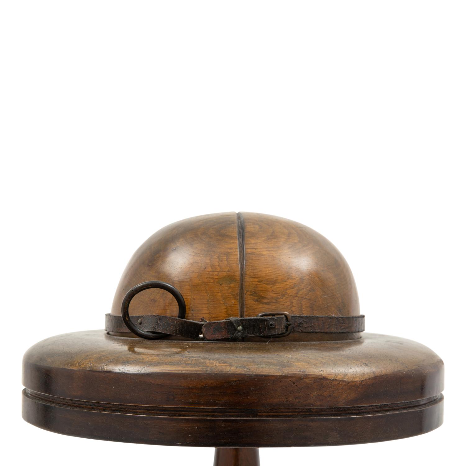 A Walnut and Leather Hat Block or Millinery Form