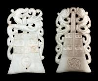 Two Celadon Jade Bell-Form Pendants