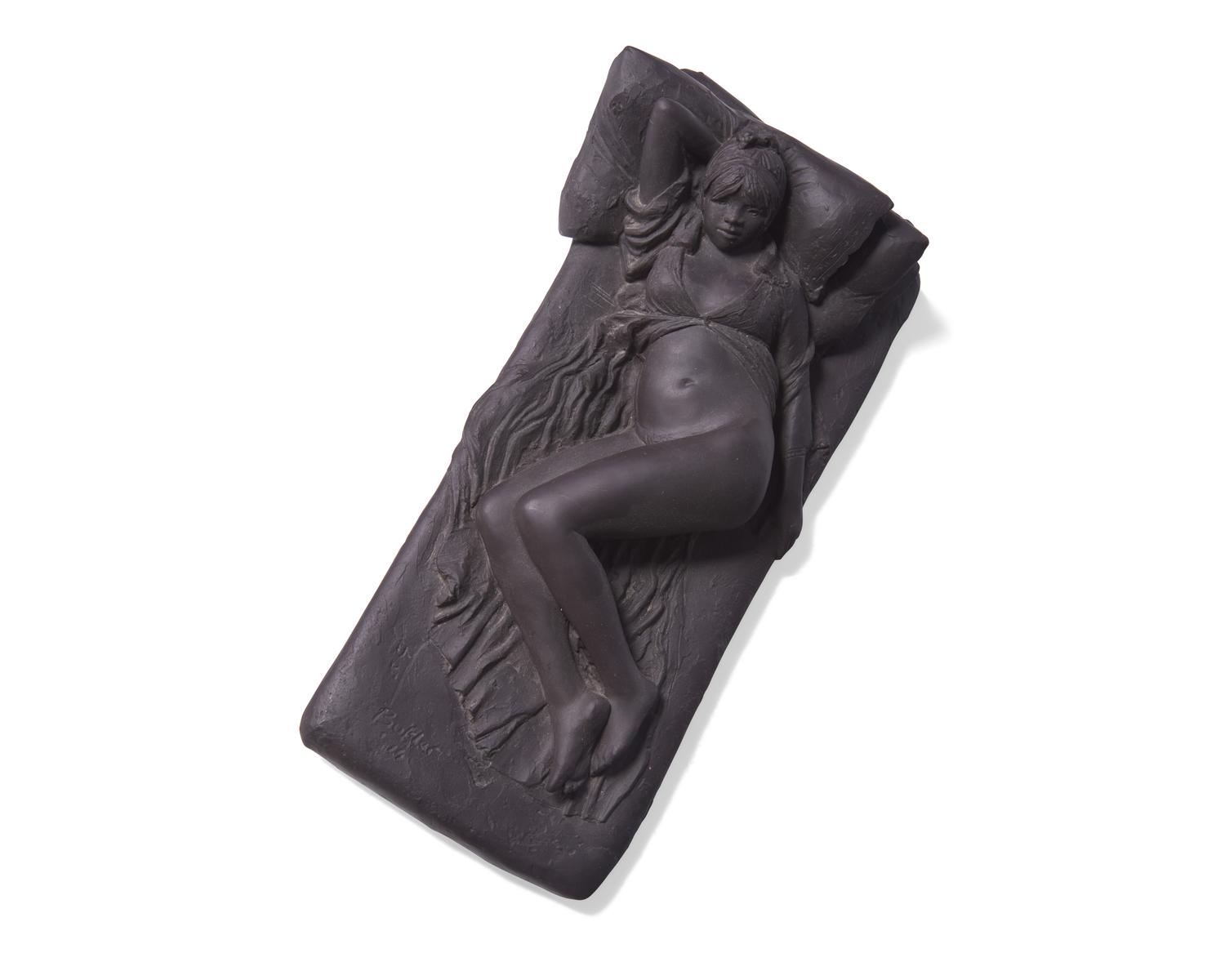 A Wedgwood Black Basalt "Girl on Bed" Figure