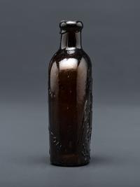 A Molded-Glass Flask in Amber by Willington Glass Company, Connecticut