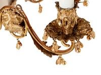 A Continental Gilt Metal and Jeweled Opaline Glass Twelve-Light Chandelier