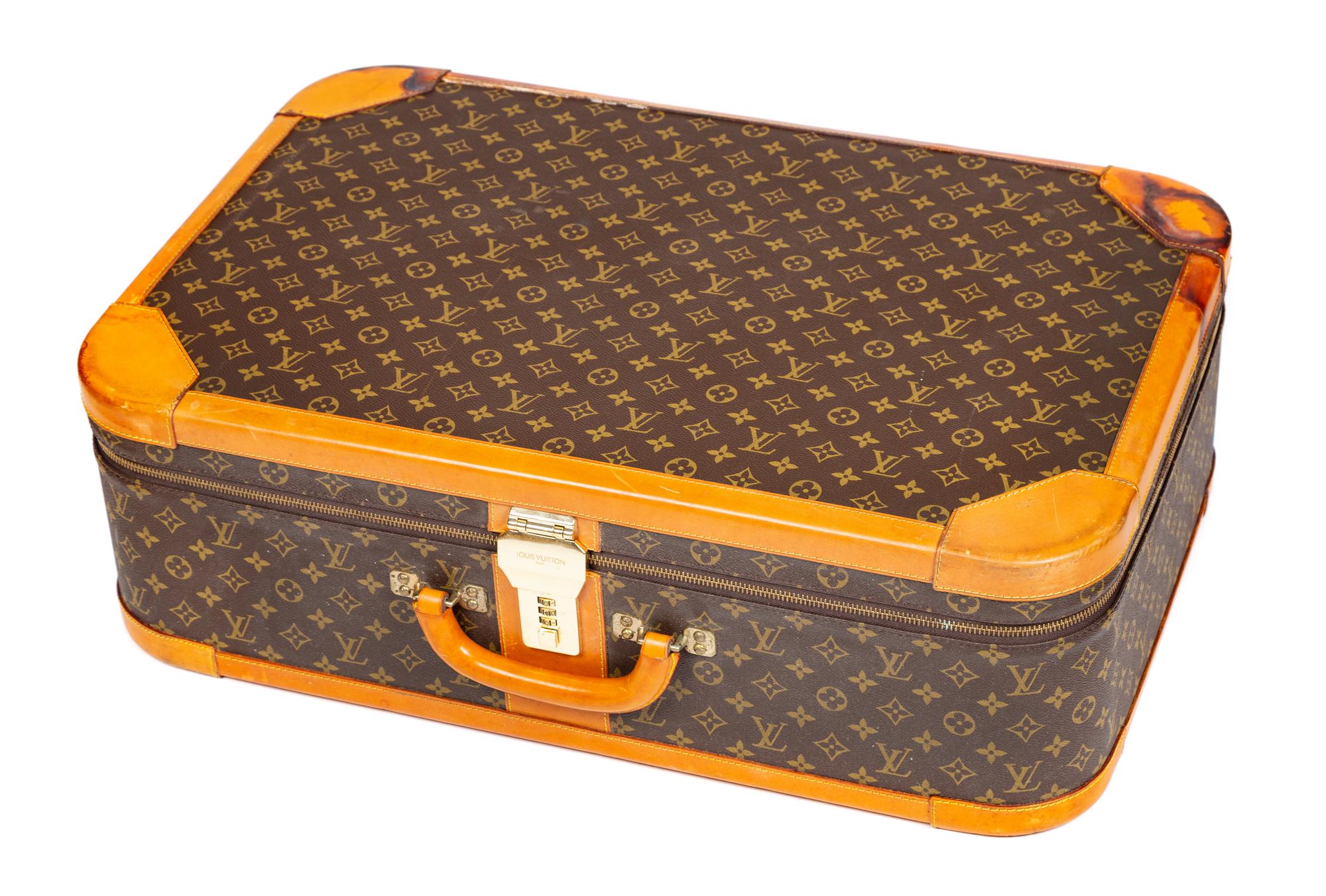 A Louis Vuitton Stratos Monogram Canvas Soft Sided Suitcase, 27.5" L x 17.75" H x 8.25" D; Handle drop: 2".